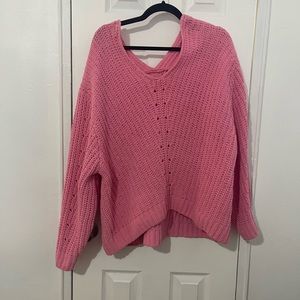 Oversized pink knit sweater.